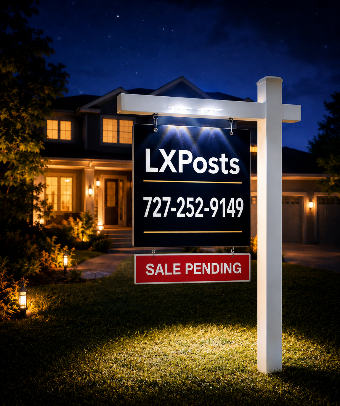White LxPosts illuminated realtor sign post at night in front of a luxury Florida home
